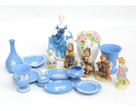 A group of Wedgwood blue jasperware comprising various pin dishes, three vases, and a circular trinket box, also a Royal Doul