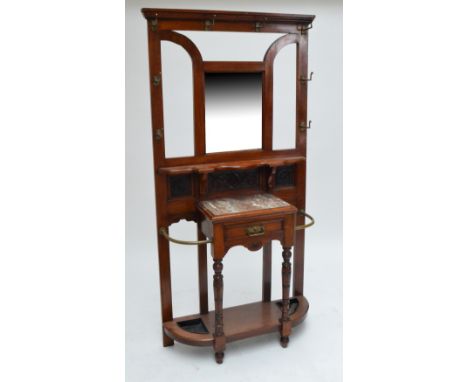 An Edwardian walnut hall stand, the central rectangular bevelled mirrored plate above marble topped single drawer and twin ap