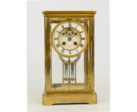 An early 20th century brass four glass eight day mantel clock, the circular two section dial set with Arabic numerals, inscri