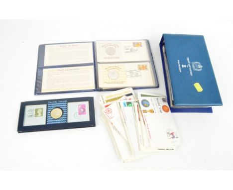 FIRST DAY COVERS; an Elizabeth II Silver Jubilee album from Pobjoy Mint Ltd, an album of Great Britains medallic first day co