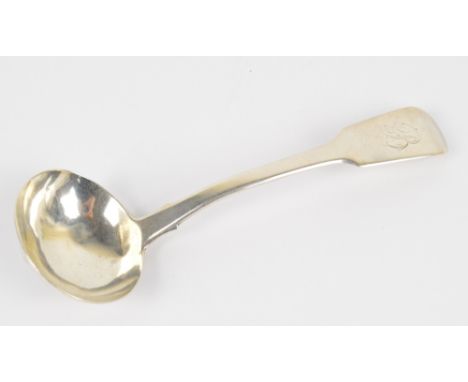 A William IV hallmarked silver fiddle pattern sauce ladle with oval bowl and finial initialled B, Jonathan Hayne, London 1827