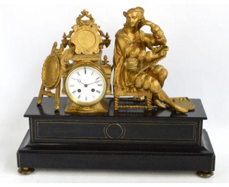 A late 19th century French gilt spelter and black slate mantel clock, the figural surmount beside a white enamel dial set wit
