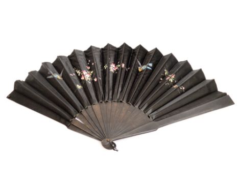 An Edwardian black folding fan with ebonised guards and sticks of plain form, with black shaped loop, the satin mount painted