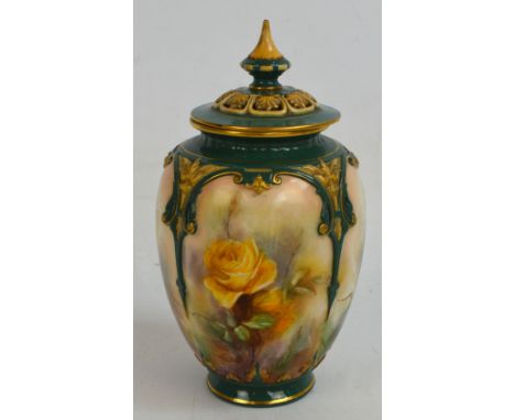 A Hadley's Worcester porcelain quatrilobed jar and cover, hand painted with floral panels separated with moulded scroll gilt 