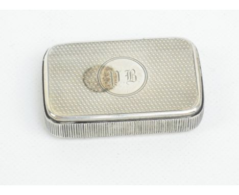 A Victorian hallmarked silver vesta case of rounded rectangular form with striker sides and engine turned decoration to the b