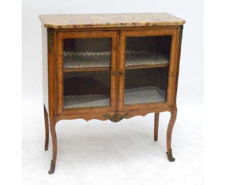 An early 20th century French kingwood display cabinet with composite marble top with canted corners, above two crossbanded gl