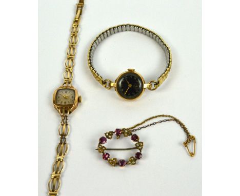 A 9ct yellow gold cased lady's wristwatch, the circular black dial set with Arabic numerals and with subsidiary seconds on an