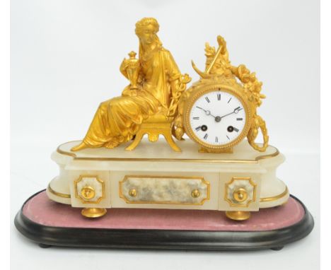 A late 19th century French gilt metal and onyx figural mantel clock, the drum type eight day movement by Gaillot of Paris wit