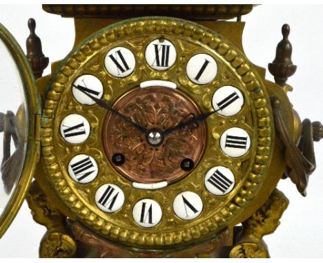 A 19th century French gilt metal three piece clock garniture, the circular dial set with black painted Roman numerals to circ