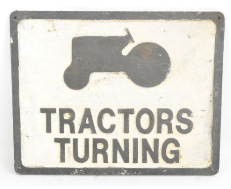 A cast alloy Tractor Turnings sign, width 49cm.