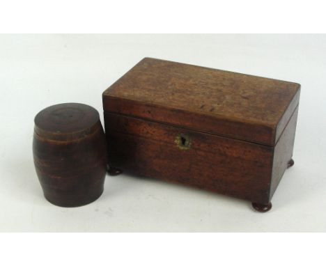 A 19th century oak tea caddy of plain circular form with two division lidded interior on turned bun feet, length 21cm, and a 
