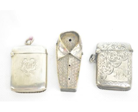 An Edward VII hallmarked silver vesta case of rounded rectangular form with overall foliate scroll decoration and initialled 