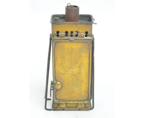 A late 19th/early 20th century brass carriage travelling lamp of rectangular form with adjustable stem, hinged front and fold