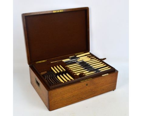 A cased electroplated twelve setting canteen of Old English pattern cutlery and flatware by Walker & Hall, with two pull-out 