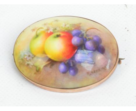 A Royal Worcester porcelain 9ct yellow gold framed oval brooch hand painted with apples, grapes and flowers, signed R. Sebrig