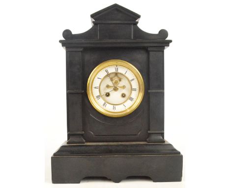 A late 19th century French black slate mantel clock with white enamel dial showing exposed escapement to a plinth base, width