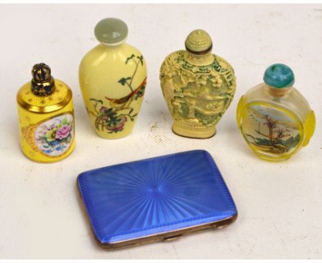 A George VI hallmarked silver blue guilloche enamel decorated cigarette case of rounded rectangular form with gilt wash inter