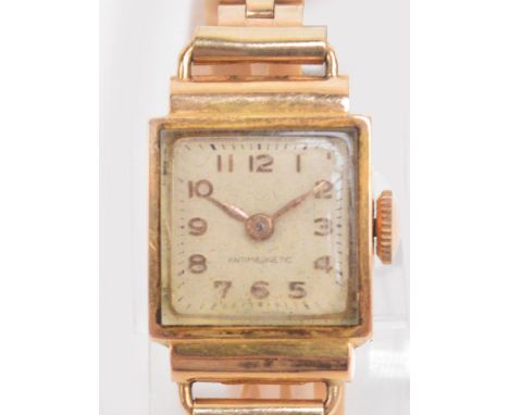 An 18ct yellow gold cased manual wind anti-magnetic lady's cocktail wristwatch, the square dial set with applied Arabic numer