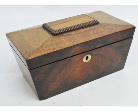 An early Victorian rosewood sarcophagus shaped tea caddy with circular mother of pearl escutcheon, the hinged lid enclosing t