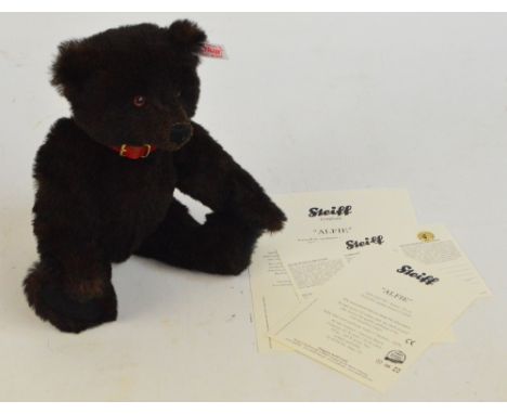 A boxed Steiff 2009 Alfie teddy bear no.663109, retailed by Danbury Mint with numbered white and red tag to ear, with dark br