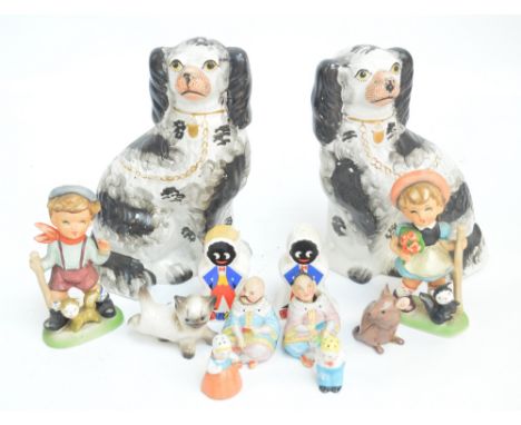 A pair of Staffordshire spaniels, height 25cm, a pair of bisque Oriental seated figures with nodding heads, a ceramic salt an