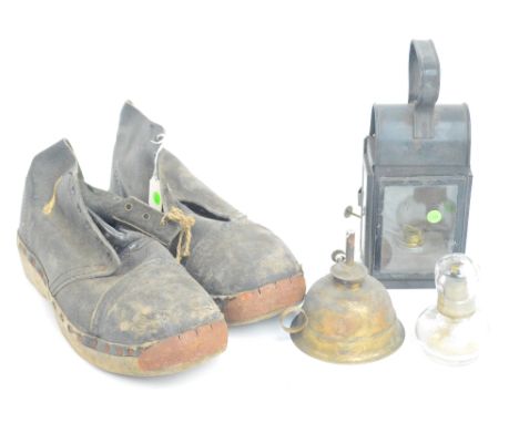 A small glass chemist's spirit lamp, height 9.5cm, a brass hand oil lamp and a glazed oil lantern with loop handle, also a pa