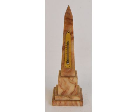 An early 20th century thermometer, the ivorine plaque applied to an alabaster obelisk, height 27cm.