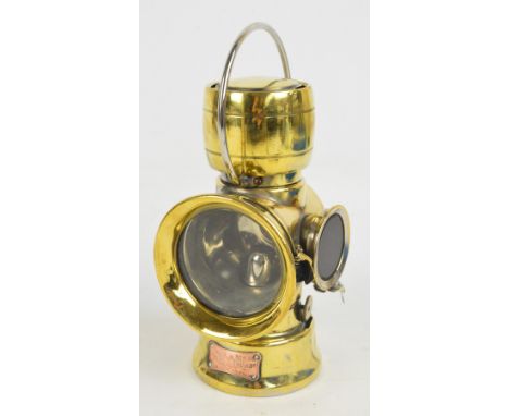 A brass Lucas "King of the Road" paraffin read number plate lamp bearing plaque inscribed "No.636", height including fixed lo
