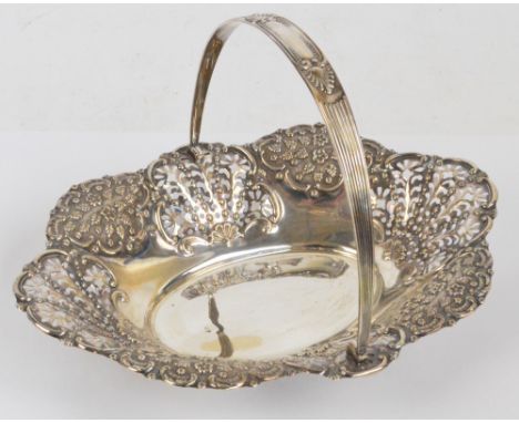 An Edward VII hallmarked silver fruit basket of shaped oval form with floral embossed and pierced sides, with cast decorated 