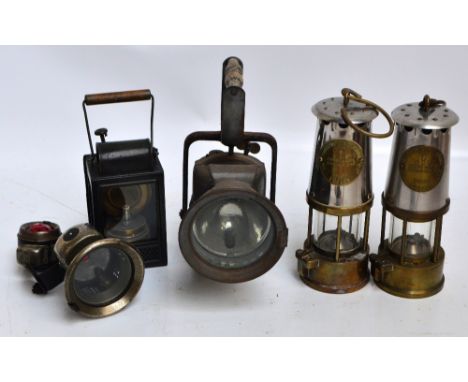 Two mid 20th century miner's lamps, a bicycle lamp, and three further lamps (6).