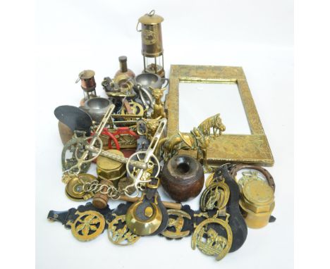 A group of various metalware to include horse brasses, a letter rack decorated with a ploughing scene, three doorstops, E. Th