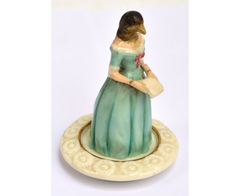 A rare 19th century Royal Worcester porcelain figural candle snuffer modelled as Jenny Lind depicted with bird's head, a Swed