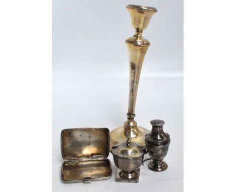 A George V hallmarked silver candlestick with bell shaped sconce and tapering stem above spreading circular loaded base, Will