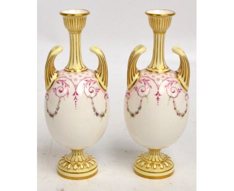 A pair of Royal Worcester porcelain leadless glazed vases with ovoid bodies, hand painted with floral and foliate scroll moti