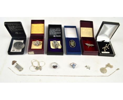 A group of six boxed brooches including a silver mother of pearl and marcasite decorated example modelled as a dragonfly and 