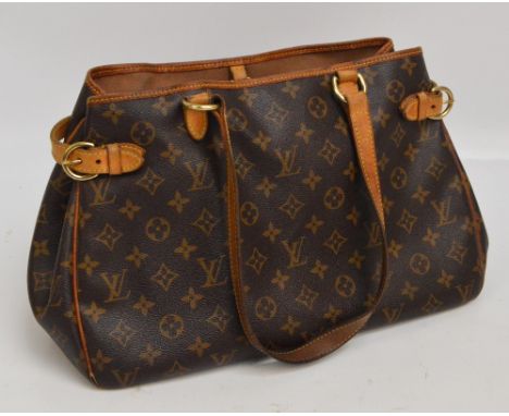 LOUIS VUITTON; a monogrammed handbag with internal zipped compartment, width approx 36cm, bearing serial no.DU0056, purchased