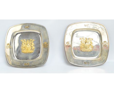 ASPREY; a pair of cased limited edition Elizabeth II hallmarked silver and silver gilt plates of rounded square form, each wi