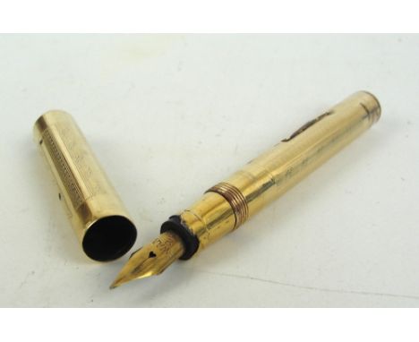 A gold plated "Swan Pen" fountain pen with engine turned decoration and 14ct yellow gold nib, by Mabie Todd & Co, New York, w