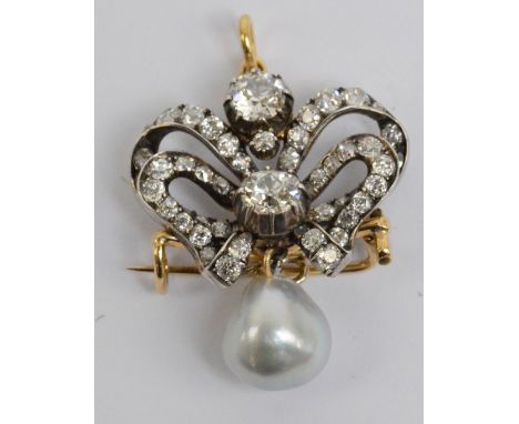 A late 19th century yellow and white metal diamond and pearl pendant/brooch, the ribbon tied frame set with two principal sto