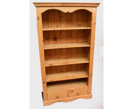 A pine open shelf bookcase, height 183cm, width 98cm.