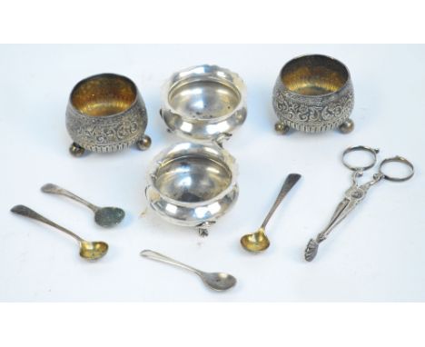 A pair of Victorian hallmarked silver circular open salts of small dimension with repoussé floral decoration, vacant circular
