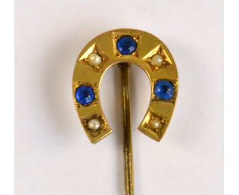 An Edwardian cased 9ct gold stick pin with cultured pearl set to the horseshoe terminal, length 5.25cm, case associated.