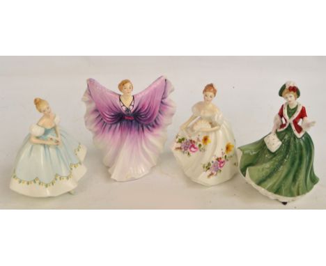 Four Royal Doulton figures; HN2938 "Isadora", HN3002 "Marilyn", HN2803 "First Dance", and HN4242 "Christmas Day 2000" (4).