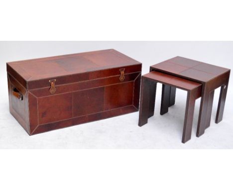 A large contemporary leather clad trunk with twin carrying handles and a nest of two matching occasional tables, width of tru