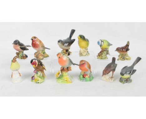 A group of seven Beswick figures of birds including "Grey Wagtail", model no.1041, "Whitethroat", model no.2106 and "Greenfin