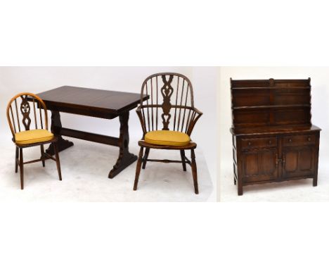 A 1940s dark oak Ercol style rectangular table, 71 x 114cm, a set of five chairs (4+1), and a dresser with boarded plate rack