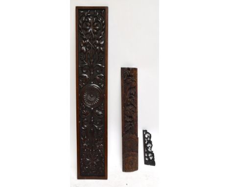 A large rectangular carved oak panel decorated with vines, grapes and ornamental motifs, 165 x 30cm, a further similar decora