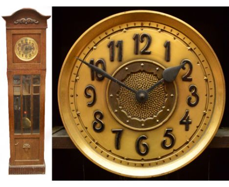 A 1920s oak three weight longcase clock, the circular dial set with applied Arabic numerals, with domed pediment above glazed