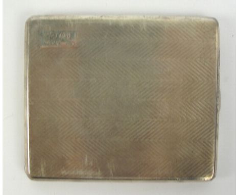 A George V hallmarked silver cigarette case of rectangular form with overall engine turned decoration and rectangular initial