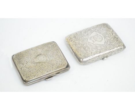 Two George V hallmarked silver cigarette cases of rounded rectangular form, both overall engraved with foliate scrolls, one c